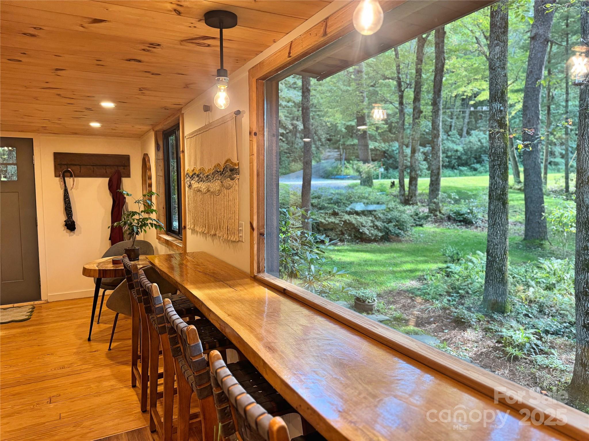 6622 Gingercake Road Newland, NC 28657 - Photo 5 of 48 a view of a living room and floor to ceiling window or wooden floor