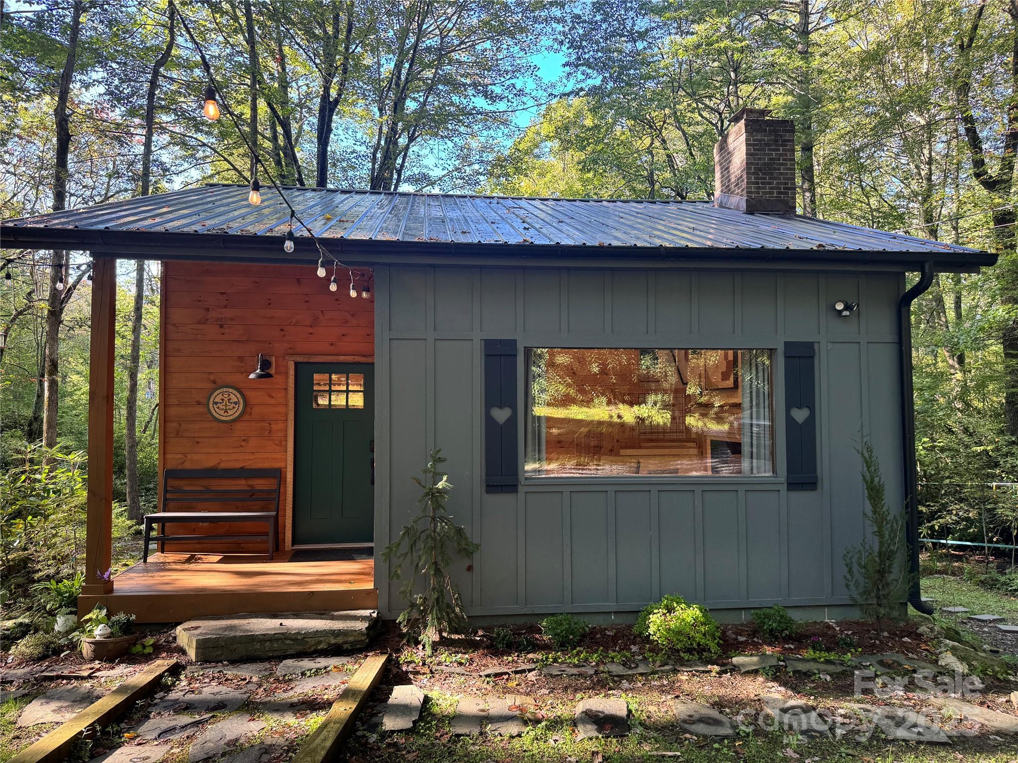 6622 Gingercake Road Newland, NC 28657 - Photo 7 of 48 a front view of a house with a garden