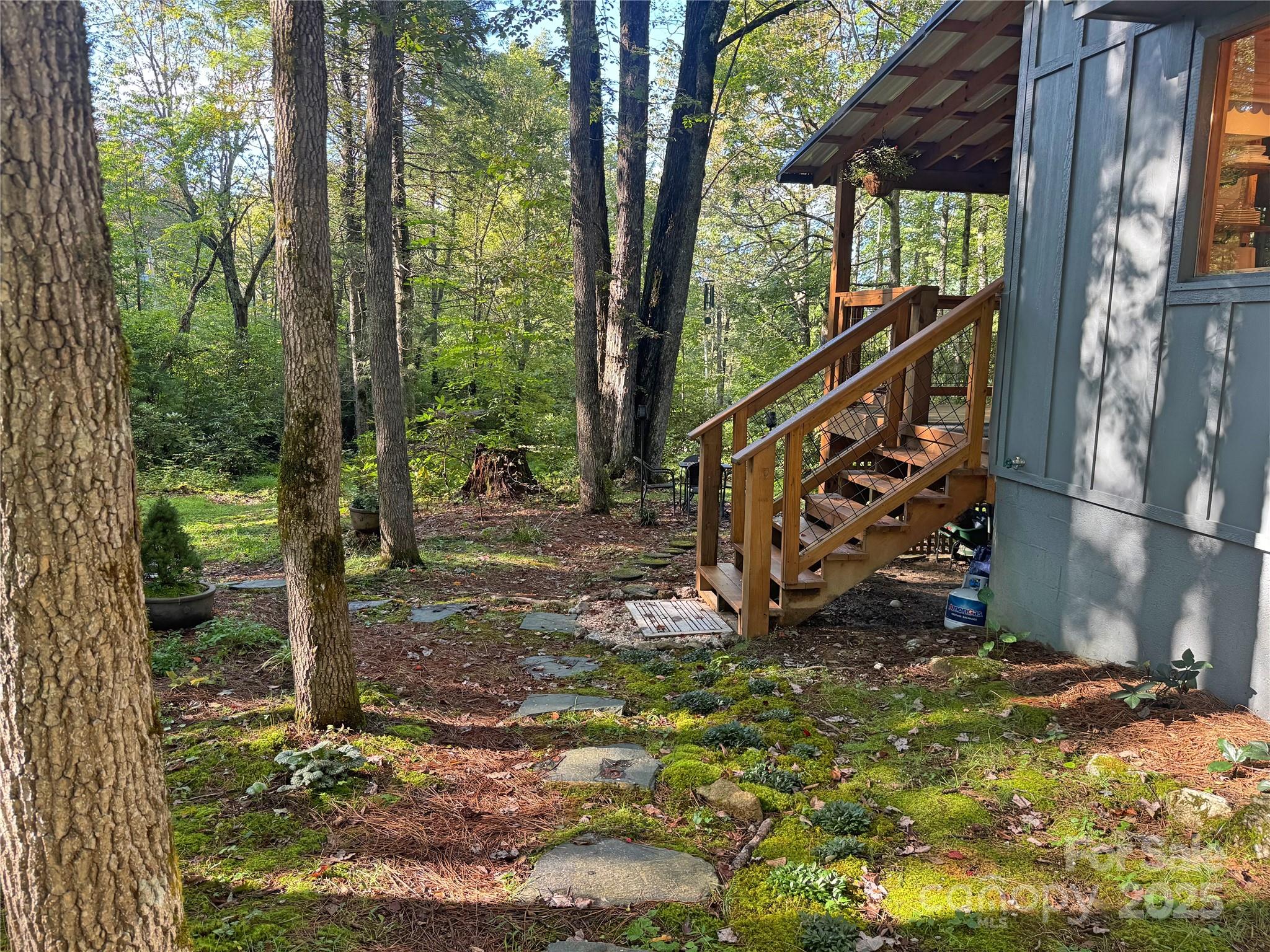 6622 Gingercake Road Newland, NC 28657 - Photo 9 of 48 a view of a wooden deck with a yard