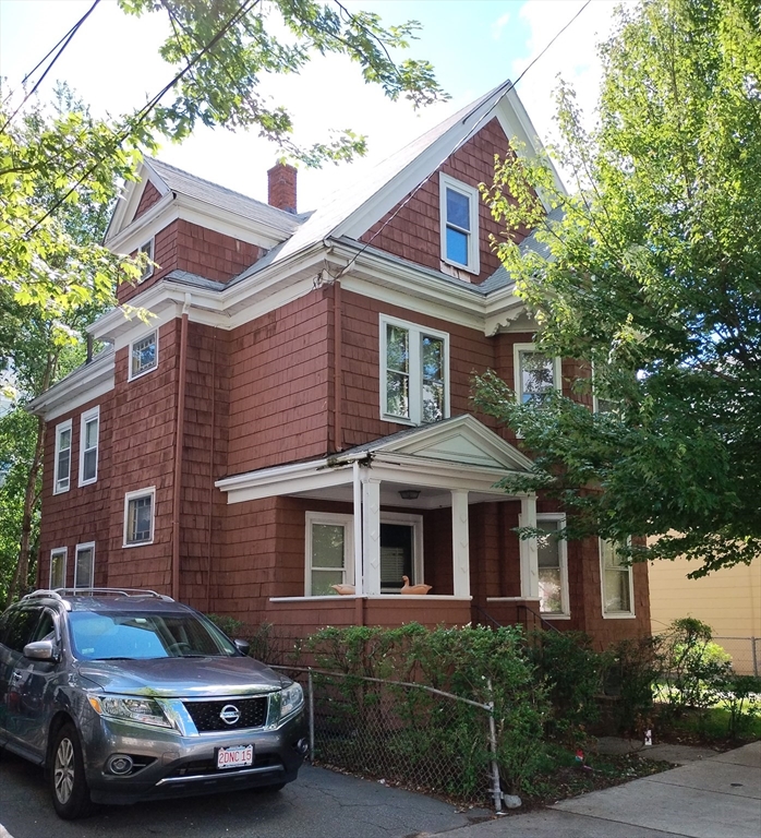 38 Valley Street Everett, MA 02149 - Photo 1 of 2 a car parked in front of a house