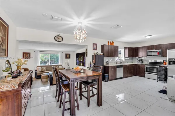 a view of kitchen with furniture and window