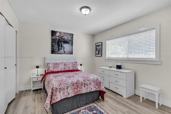 a bedroom with a bed and a table