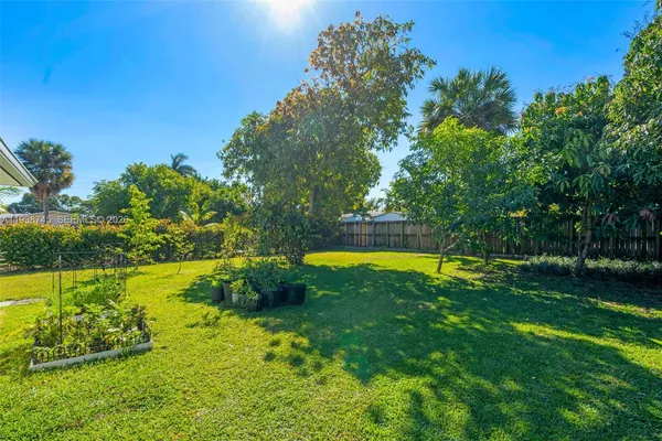 a view of a swimming pool with a yard