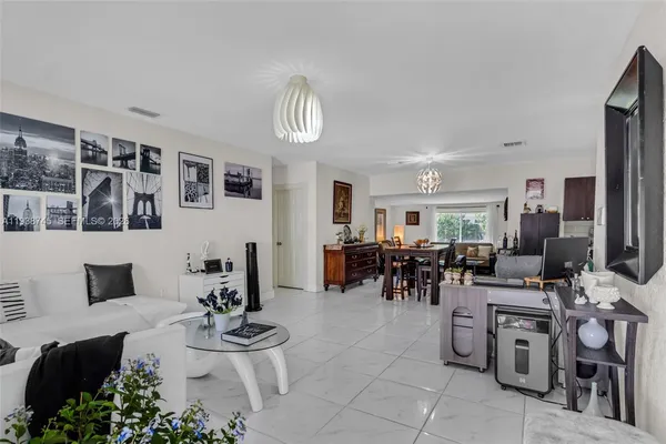 a very nice looking living room with furniture and a flat screen tv