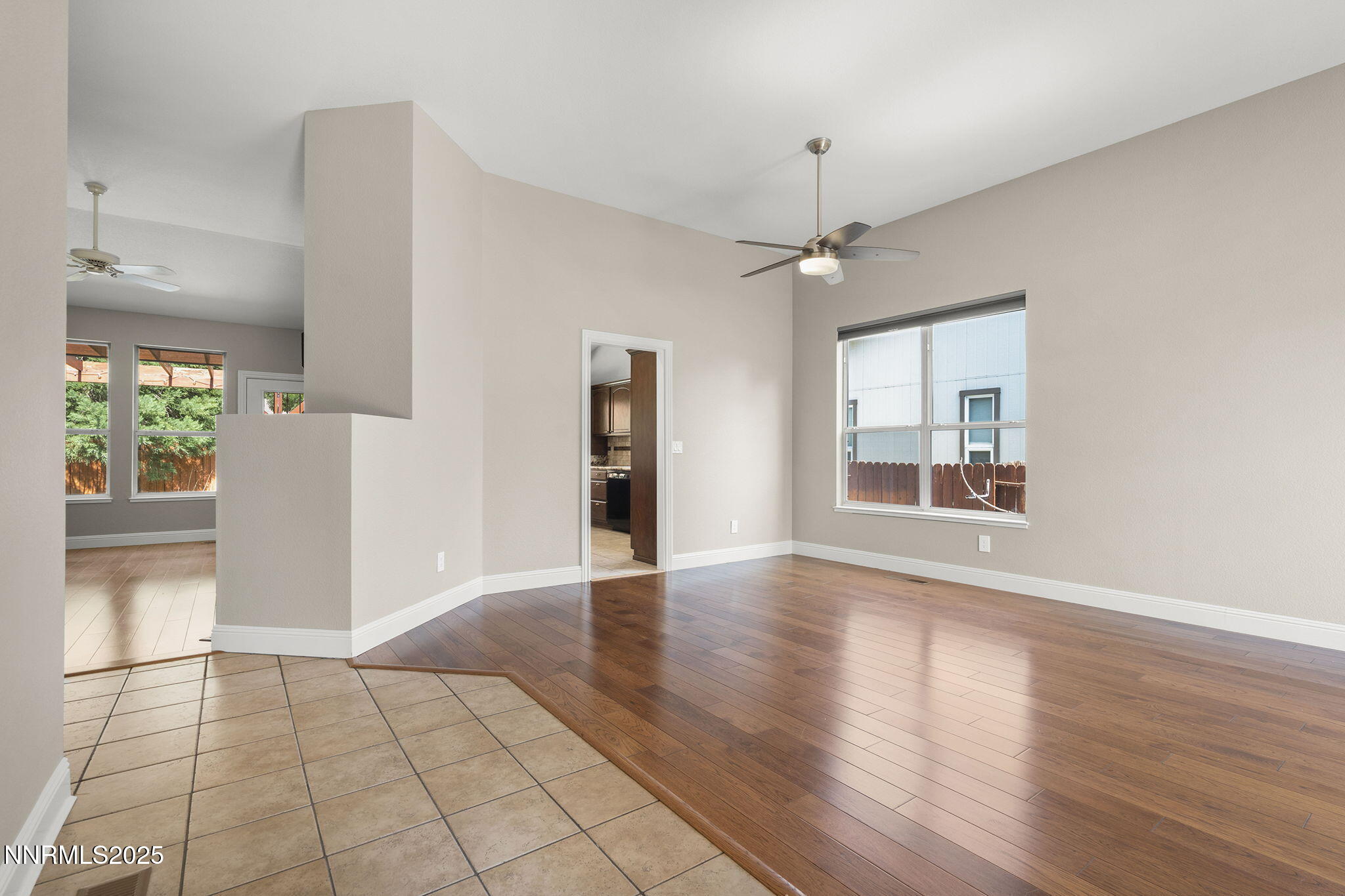4175 Falling Water Drive Reno, NV 89519 - Photo 6 of 30 a view of an empty room with window and wooden floor