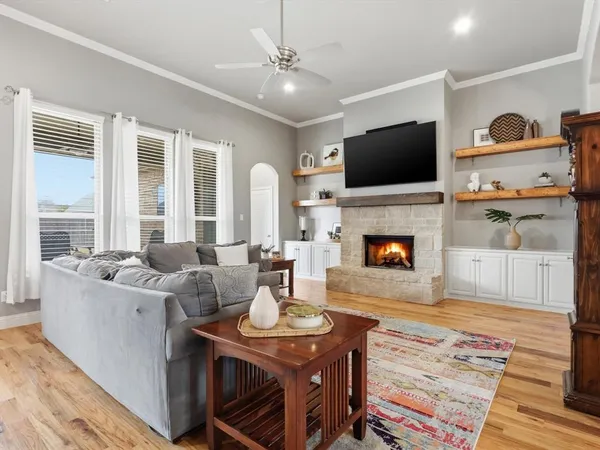 a living room with furniture fireplace and a flat screen tv