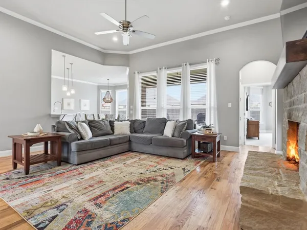 a living room with furniture and a fireplace