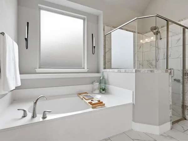 a bathroom with a tub and a sink