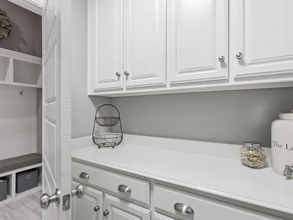 a kitchen with a sink and cabinets