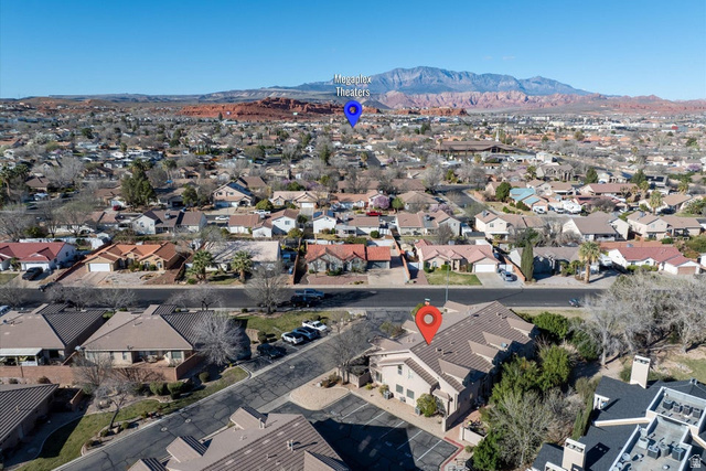 345 North 2450th Street East, Unit 152 St. George, UT 84790 - Photo 32 of 40 Aerial perspective of suburban area with a mountain backdrop