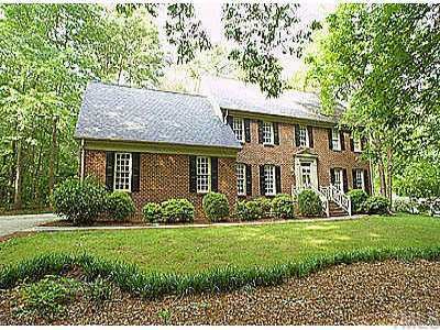 8809 Lomas Court Raleigh, NC 27615 - Photo 1 of 1 a front view of a house with a yard
