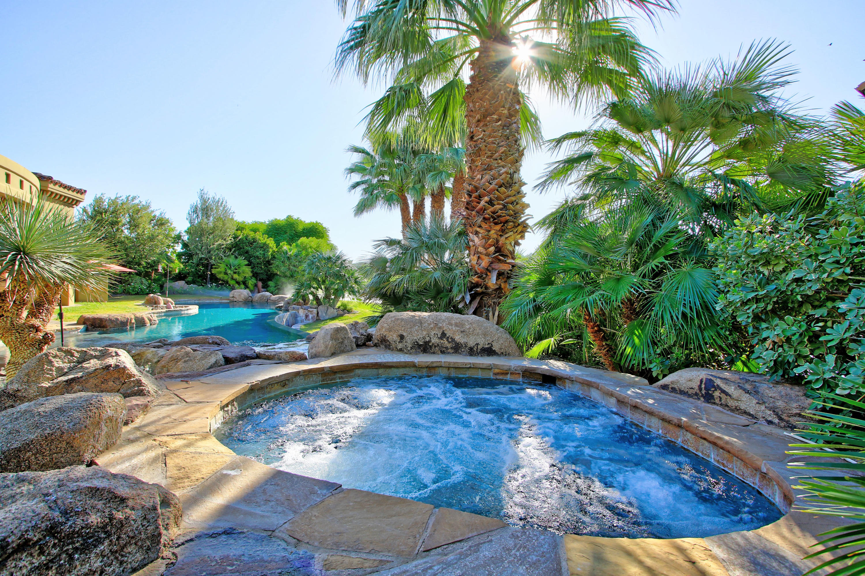 83 Royal St Georges Way Rancho Mirage, CA 92270 - Photo 108 of 123 a view of a swimming pool with a patio