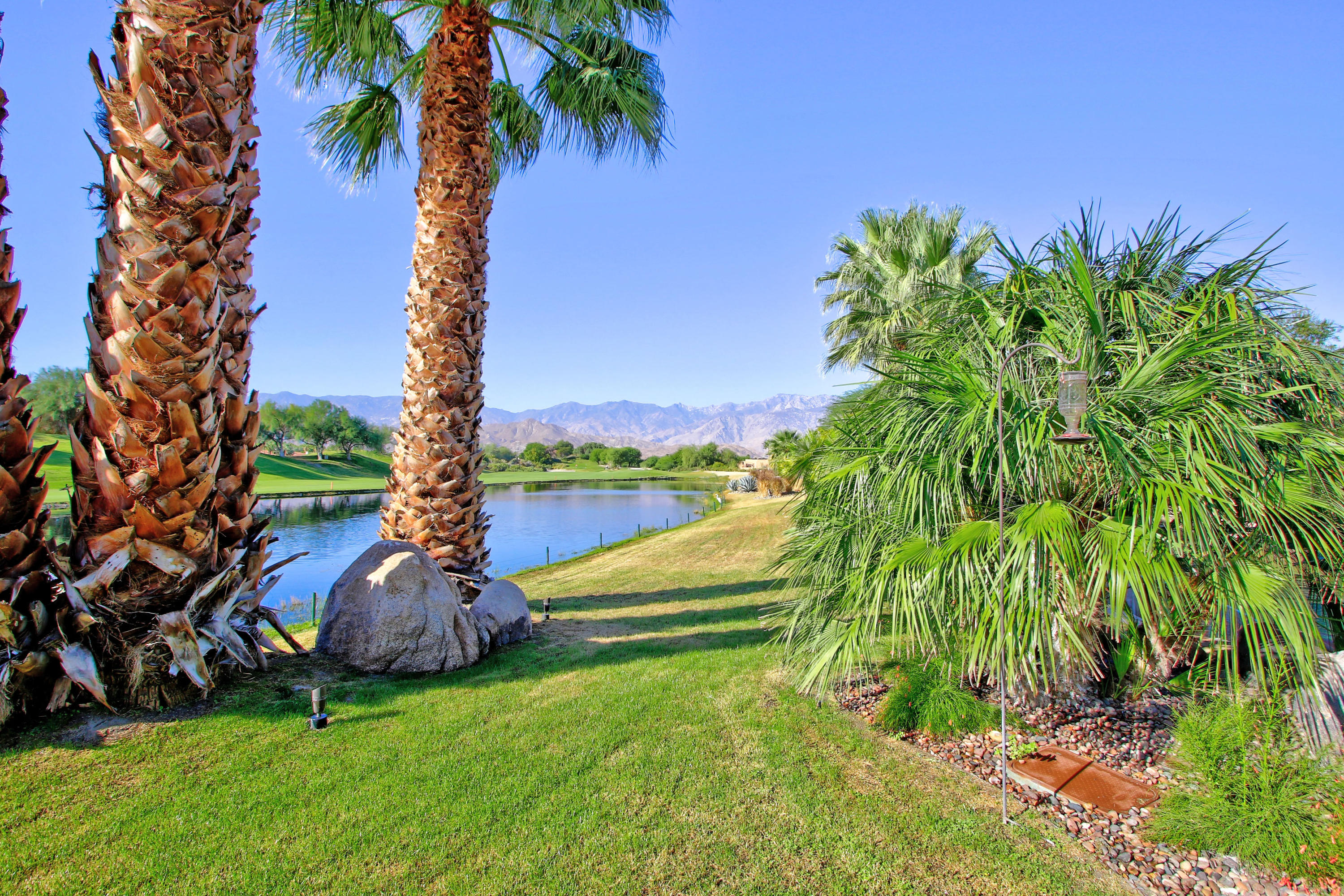 83 Royal St Georges Way Rancho Mirage, CA 92270 - Photo 112 of 123 a backyard of a house with lots of green space