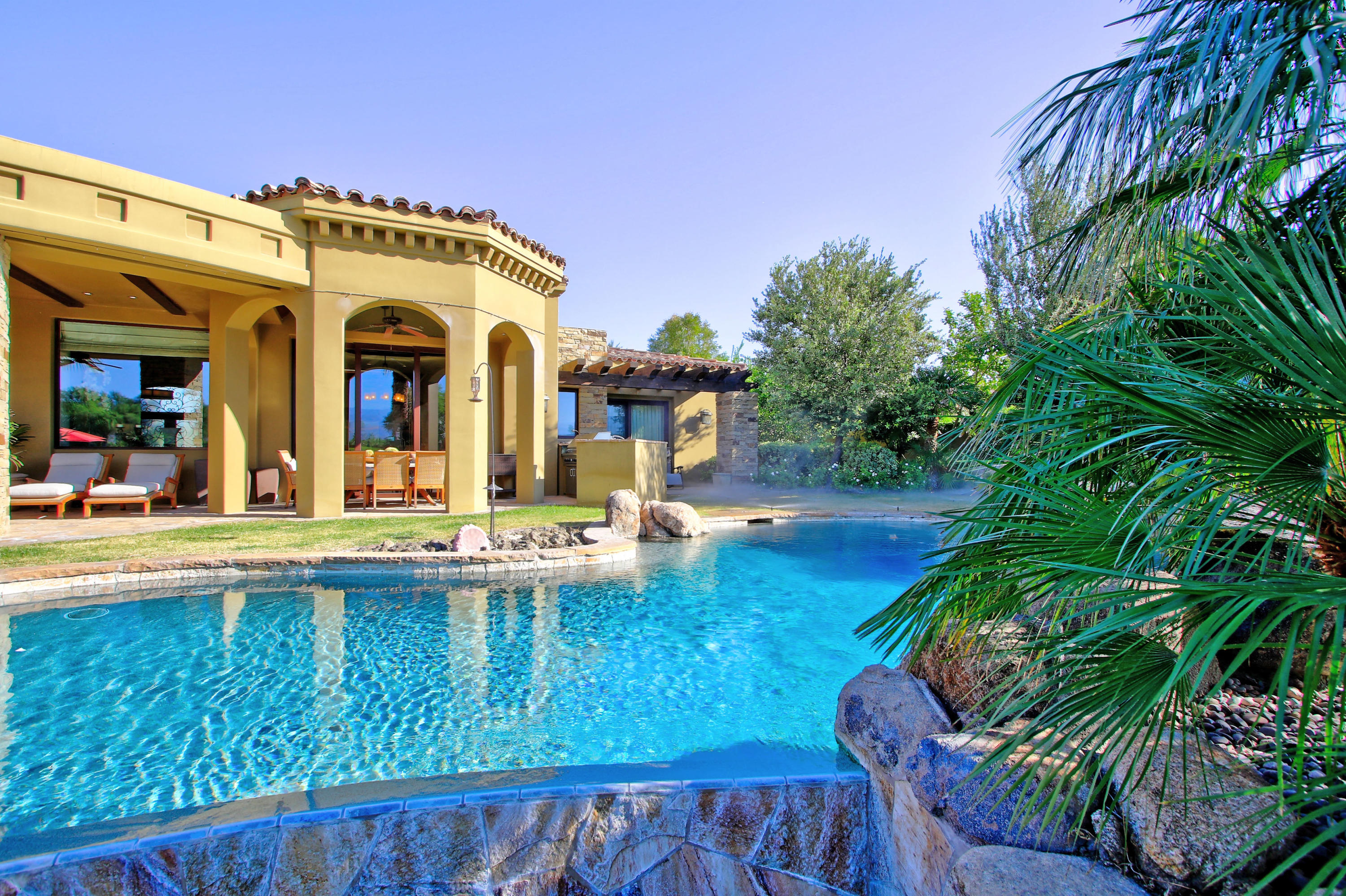 83 Royal St Georges Way Rancho Mirage, CA 92270 - Photo 115 of 123 a view of a house with swimming pool and sitting area