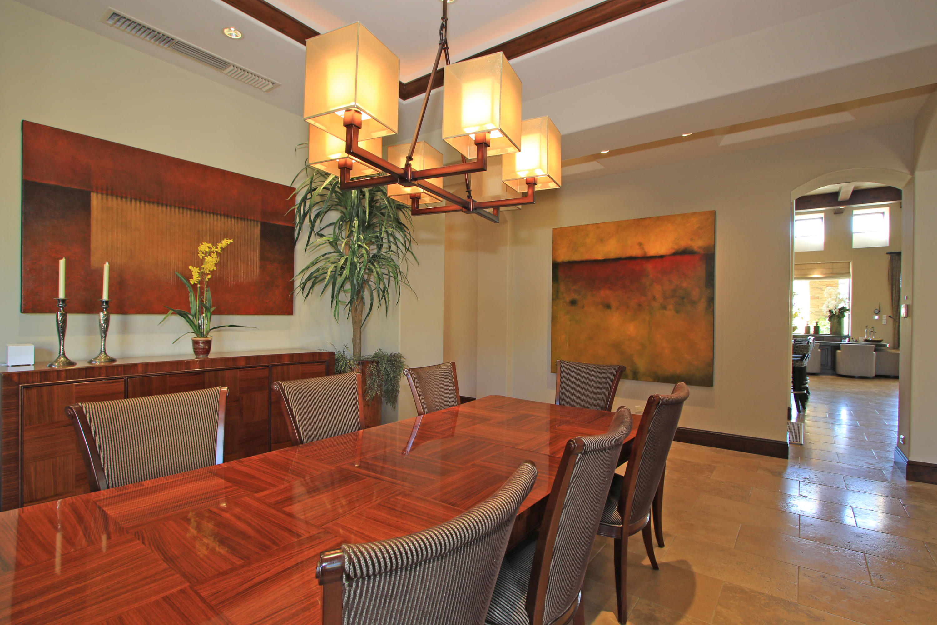 83 Royal St Georges Way Rancho Mirage, CA 92270 - Photo 16 of 123 a view of a dining room with furniture and wooden floor
