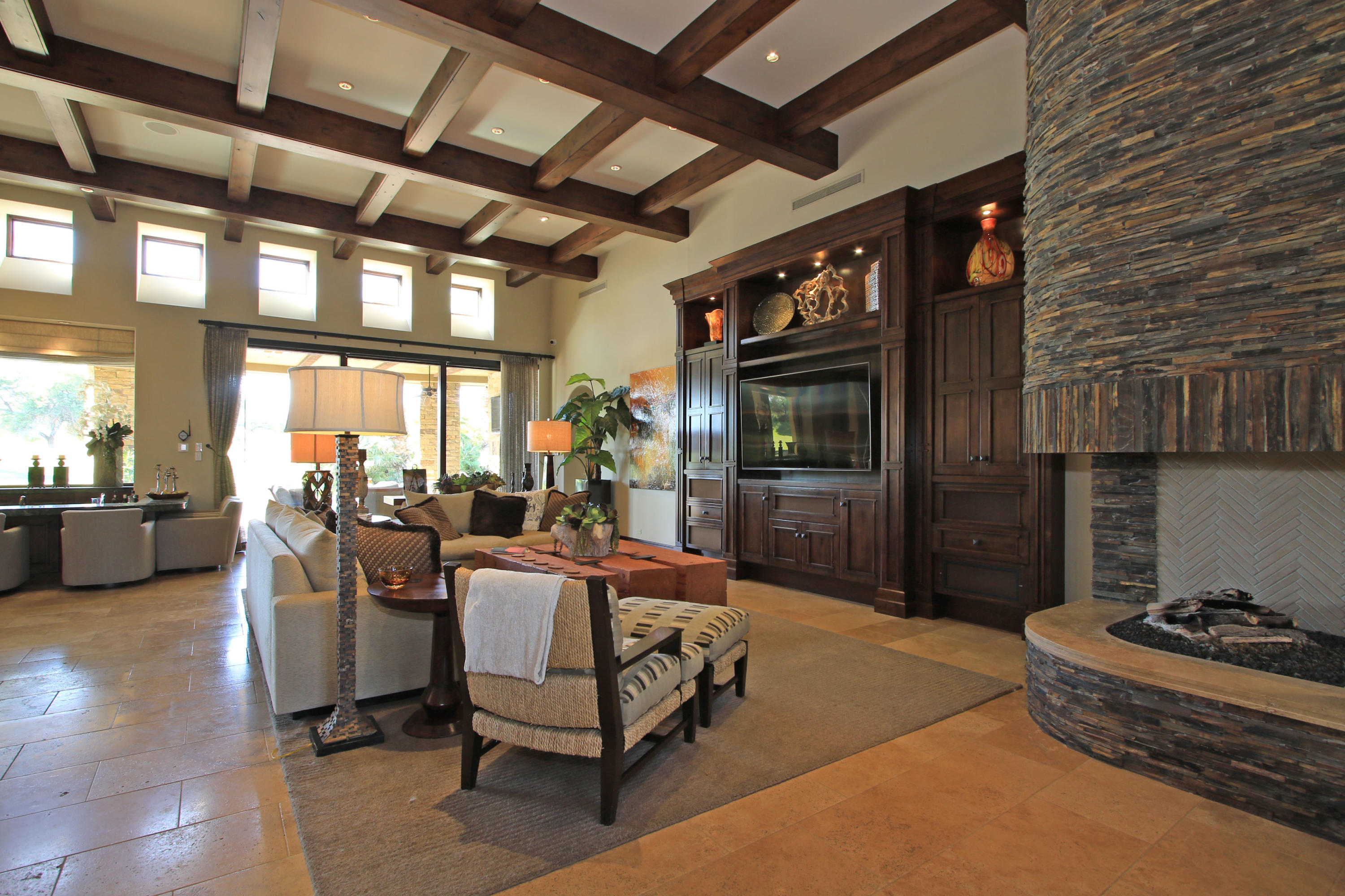 83 Royal St Georges Way Rancho Mirage, CA 92270 - Photo 18 of 123 a living room with furniture a flat screen tv and a table