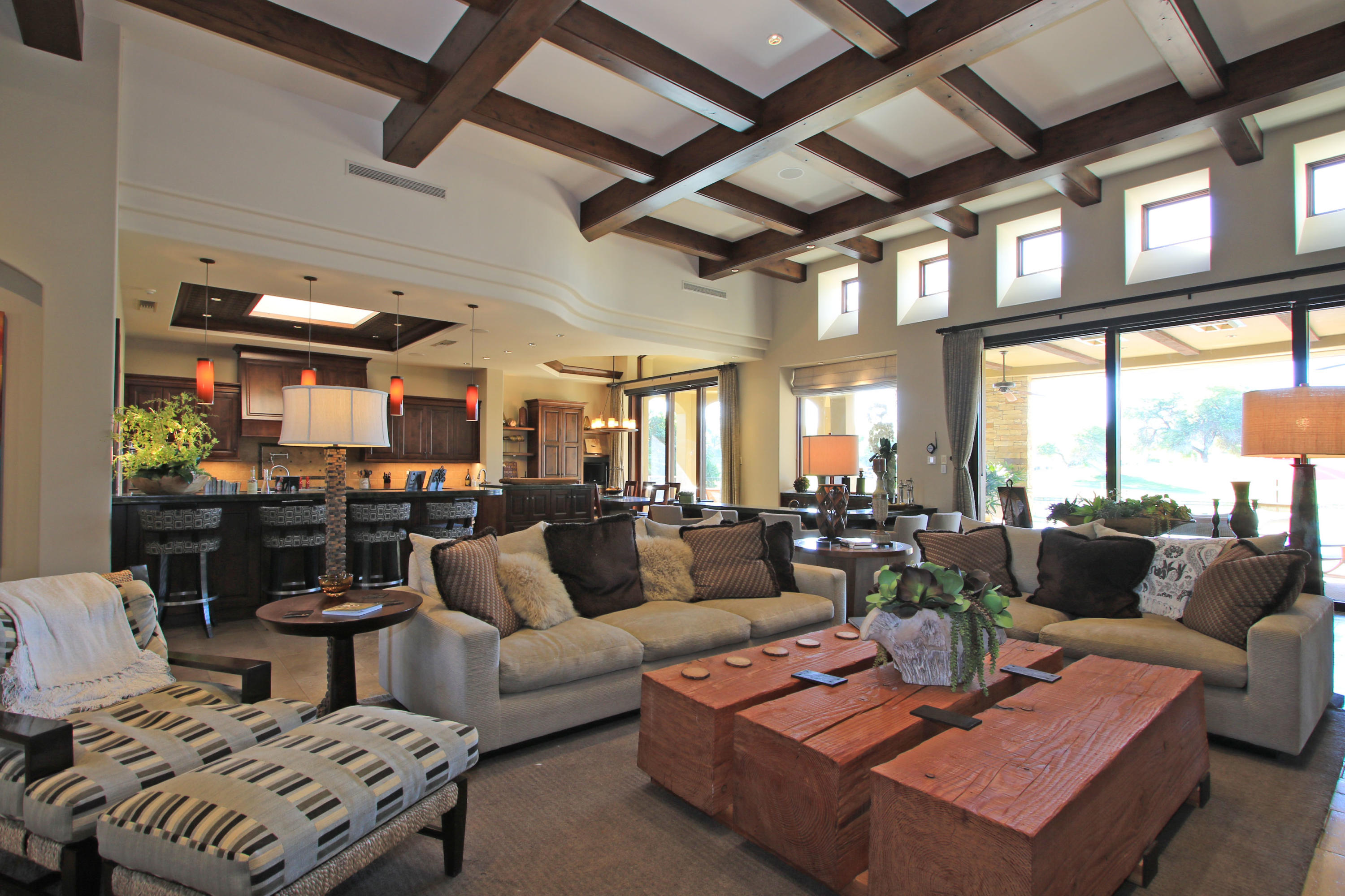 83 Royal St Georges Way Rancho Mirage, CA 92270 - Photo 19 of 123 a living room with furniture kitchen view and large windows
