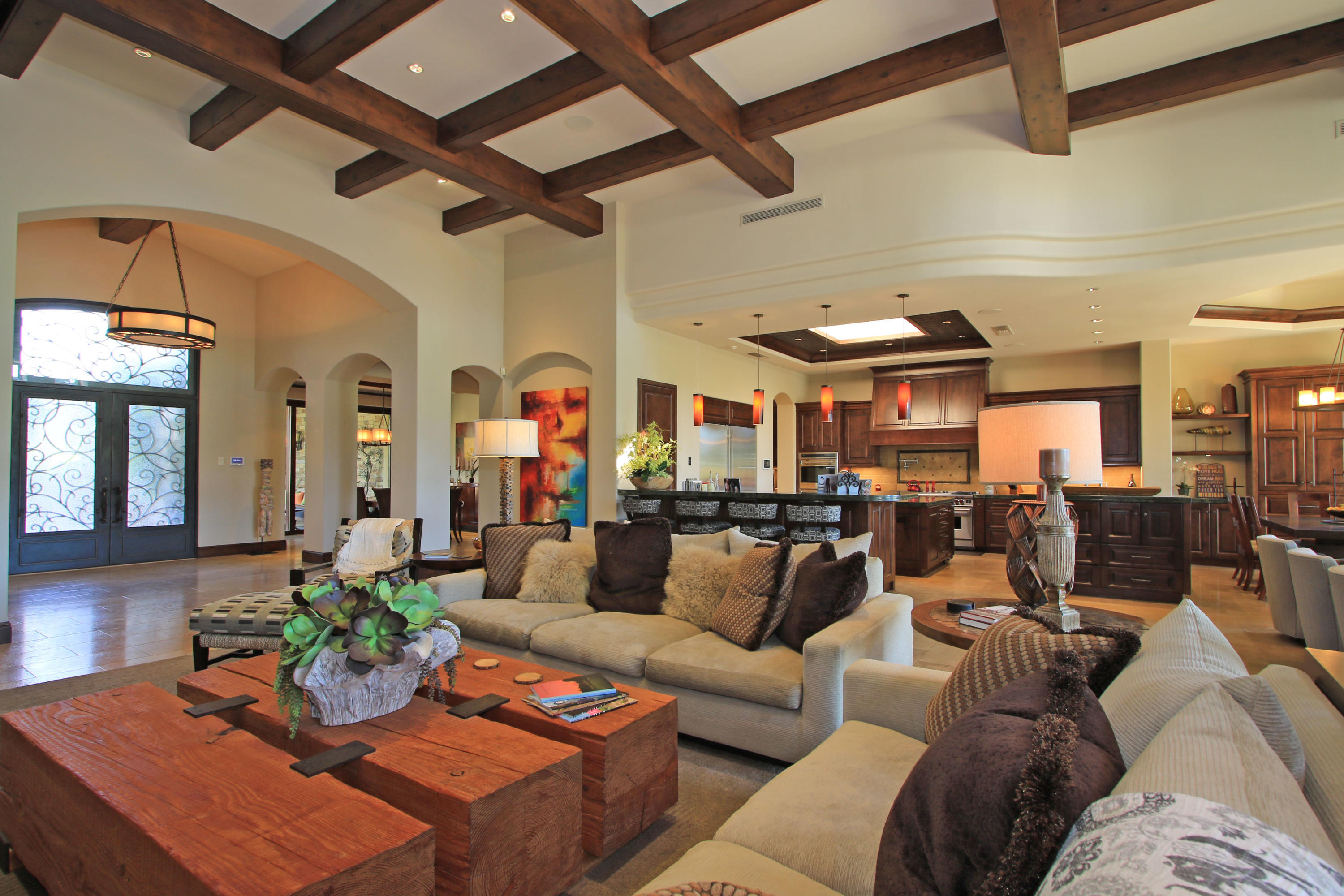 83 Royal St Georges Way Rancho Mirage, CA 92270 - Photo 20 of 123 a living room with furniture kitchen view and a chandelier