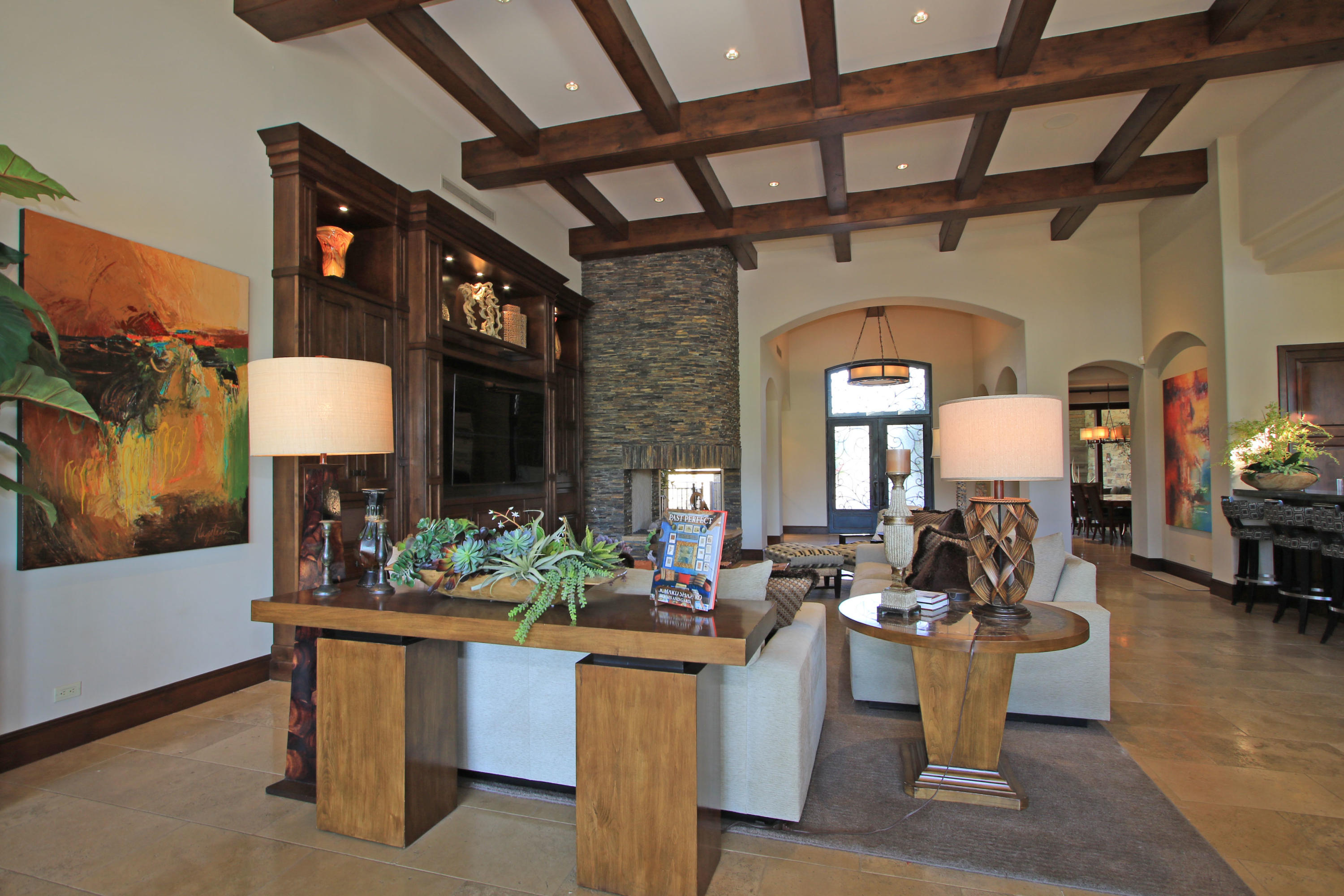 83 Royal St Georges Way Rancho Mirage, CA 92270 - Photo 21 of 123 a living room with furniture a fireplace and a table