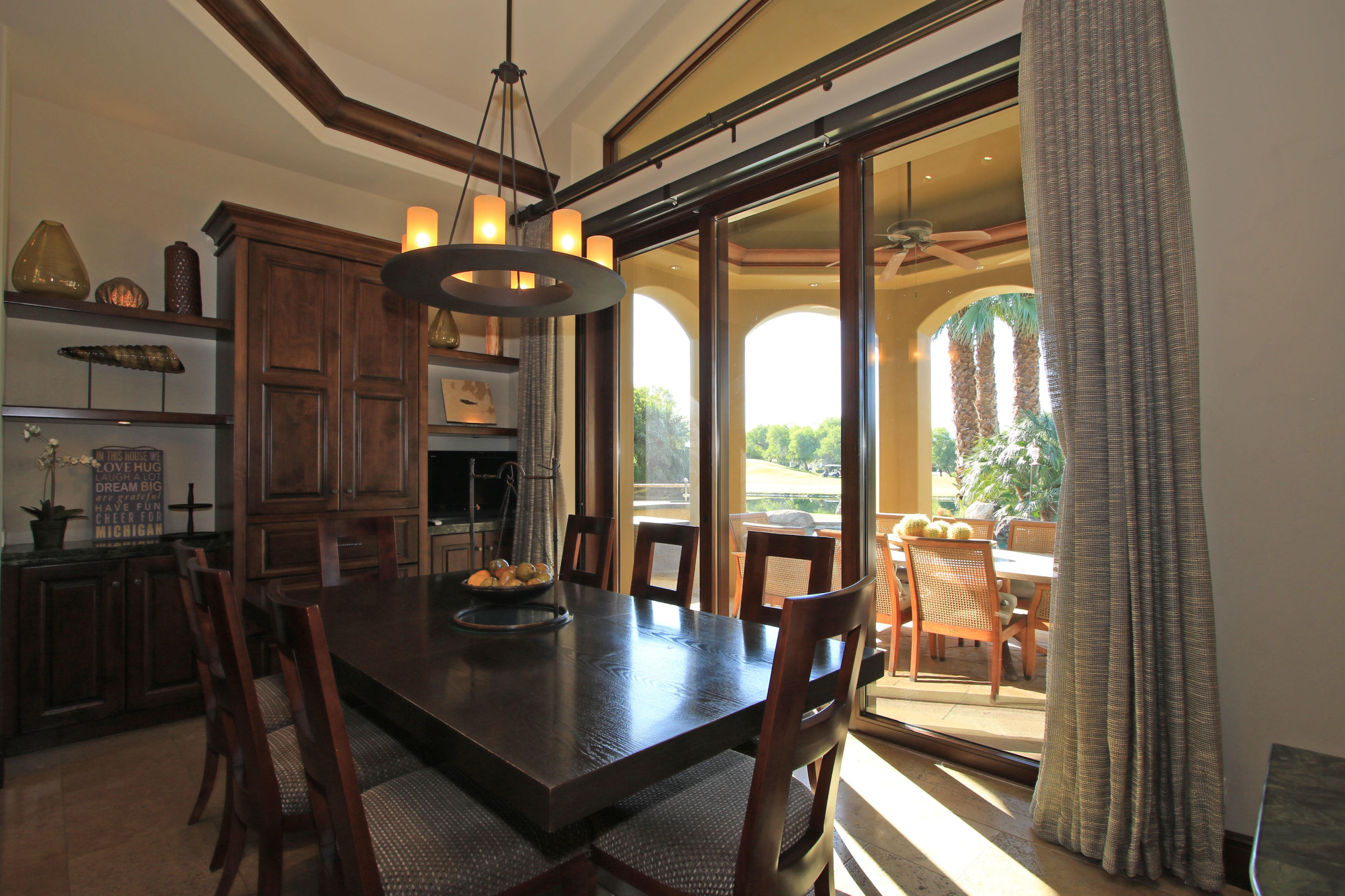 83 Royal St Georges Way Rancho Mirage, CA 92270 - Photo 28 of 123 a view of a dining room with furniture window and outside view