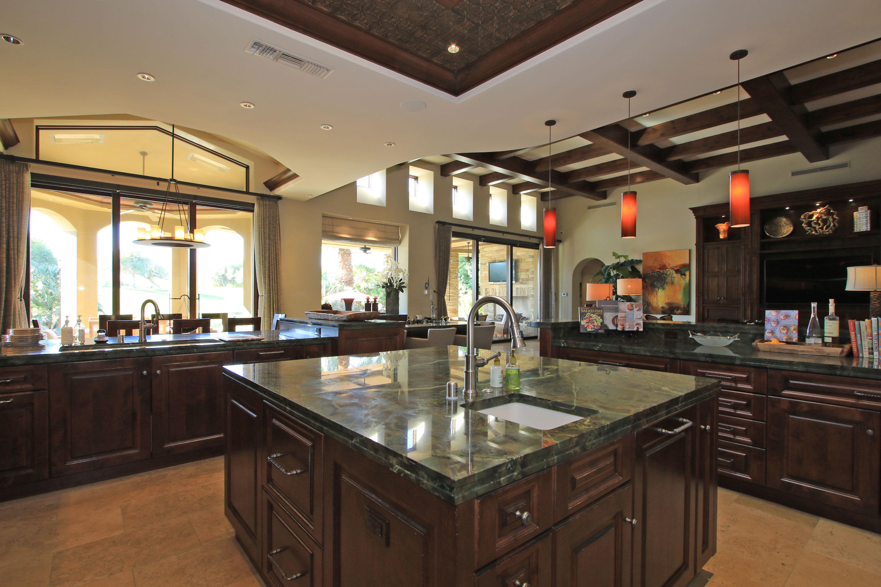 83 Royal St Georges Way Rancho Mirage, CA 92270 - Photo 36 of 123 a kitchen with stainless steel appliances granite countertop a sink a counter space and a window