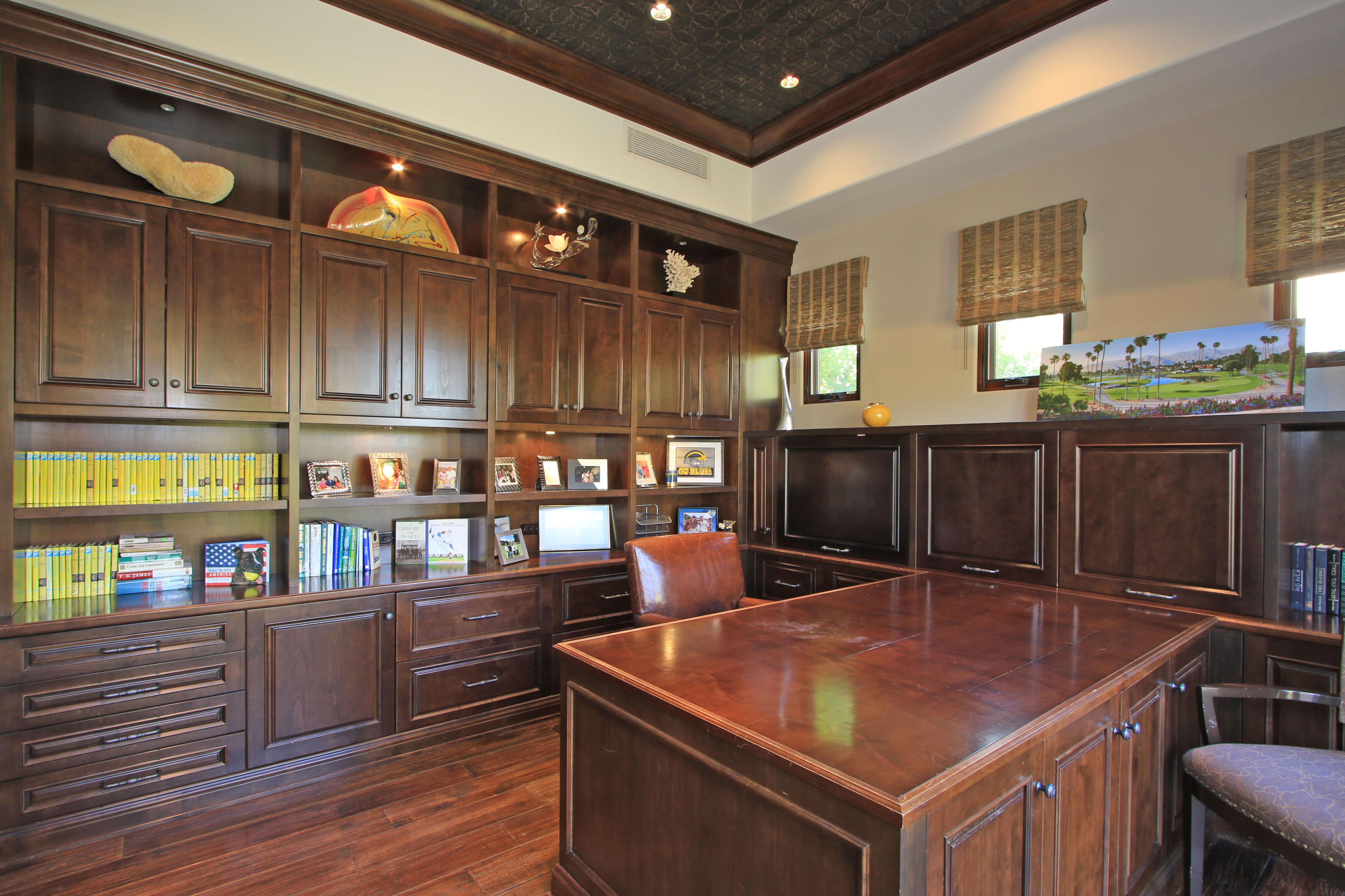 83 Royal St Georges Way Rancho Mirage, CA 92270 - Photo 43 of 123 a room with stainless steel appliances kitchen island granite countertop a refrigerator a stove and a wooden cabinets