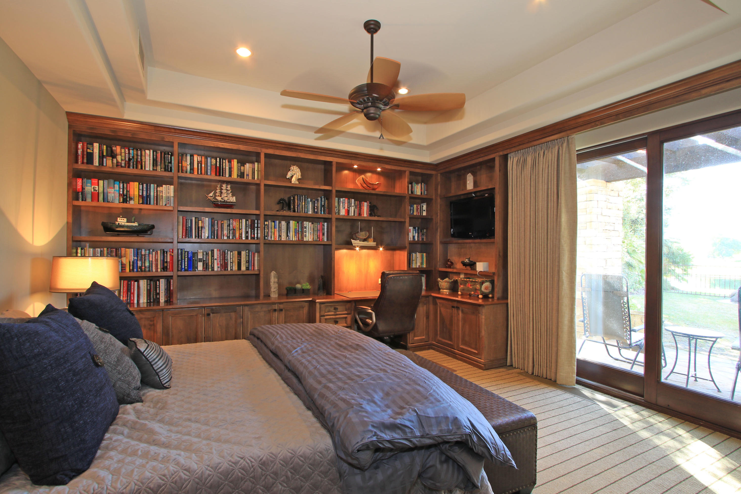 83 Royal St Georges Way Rancho Mirage, CA 92270 - Photo 60 of 123 a bed room with a bed and a book shelf