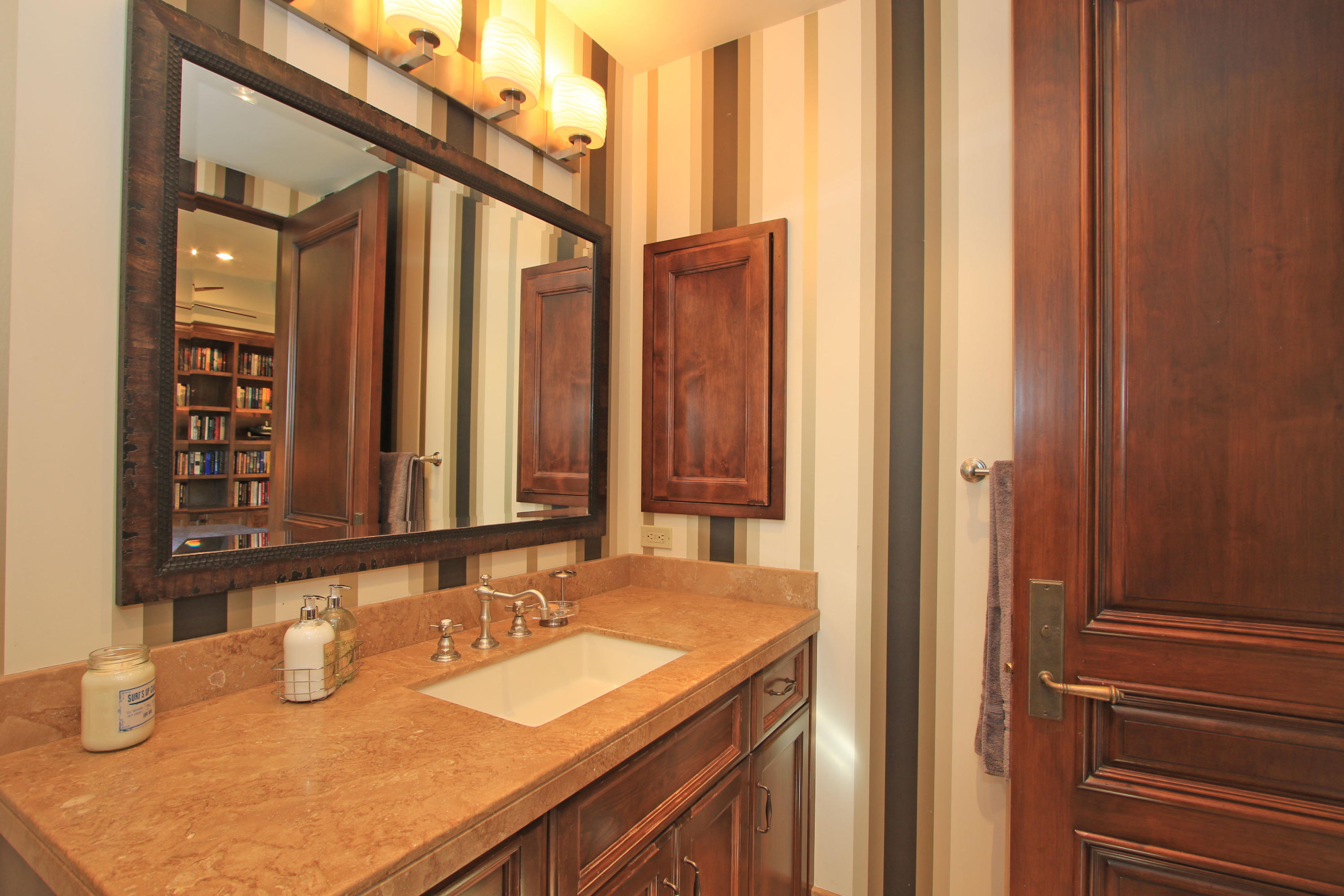 83 Royal St Georges Way Rancho Mirage, CA 92270 - Photo 63 of 123 a bathroom with a sink and a mirror