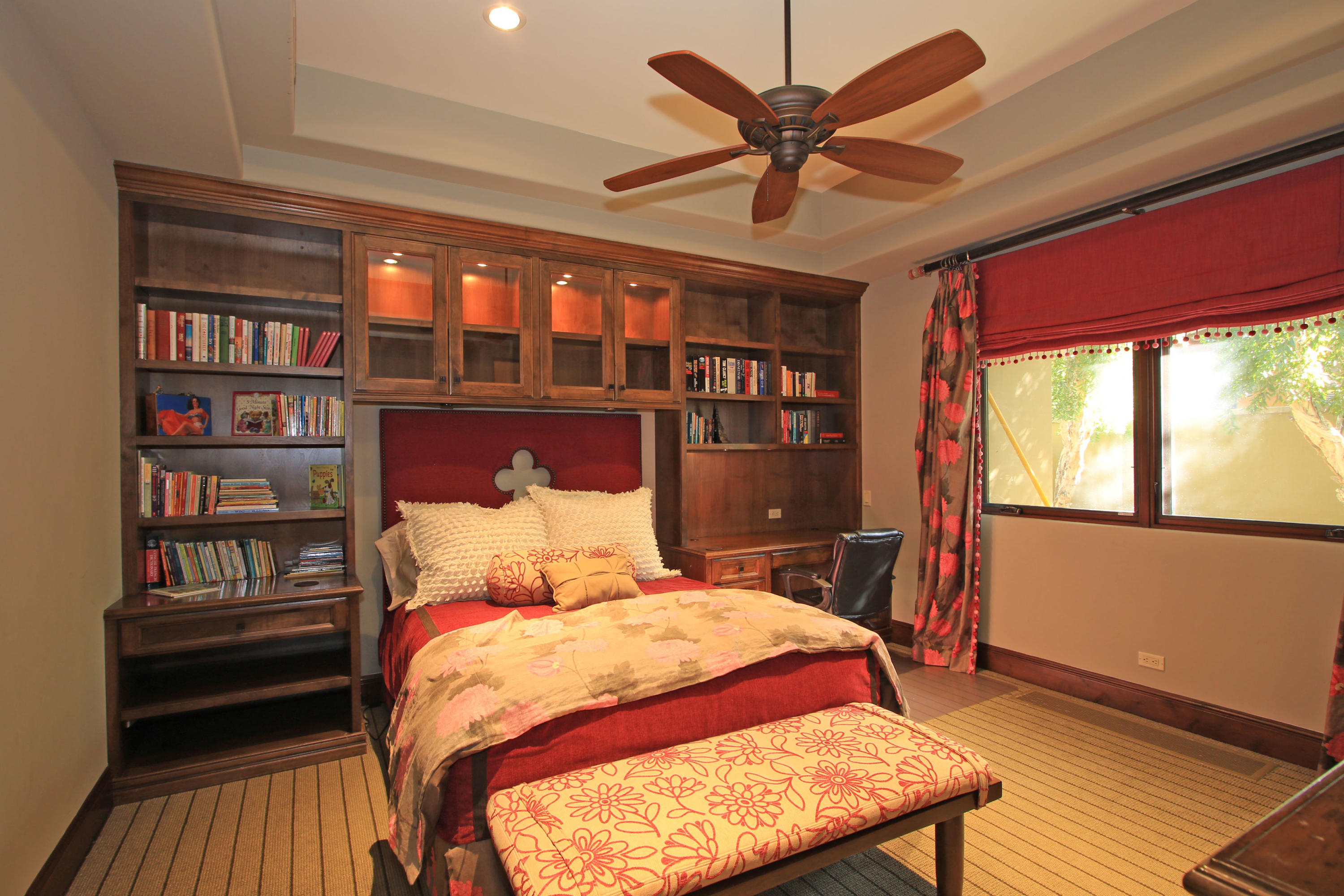 83 Royal St Georges Way Rancho Mirage, CA 92270 - Photo 64 of 123 a bedroom with a bed a dresser and a book shelf