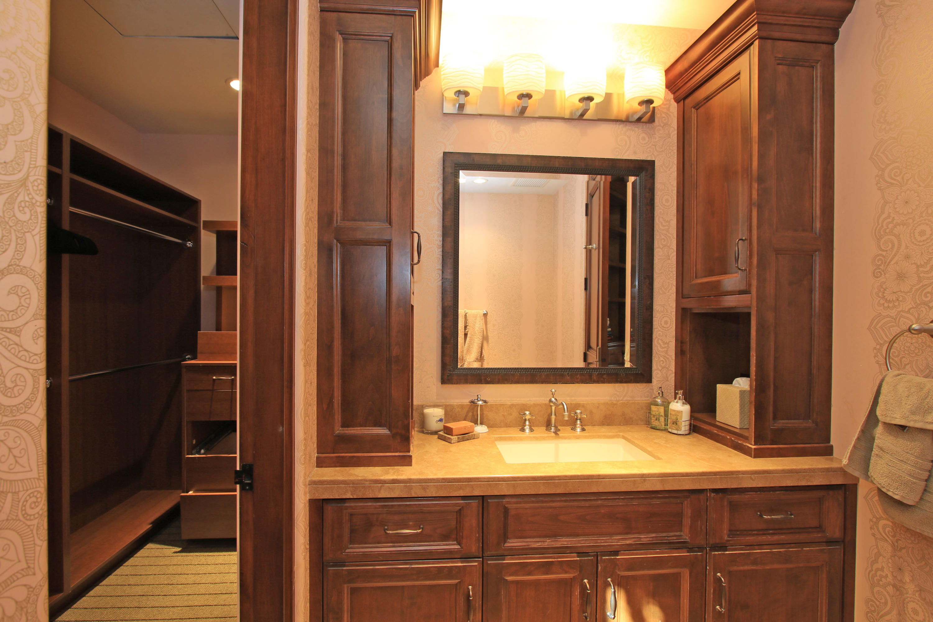 83 Royal St Georges Way Rancho Mirage, CA 92270 - Photo 68 of 123 a bathroom with a granite countertop sink and a mirror