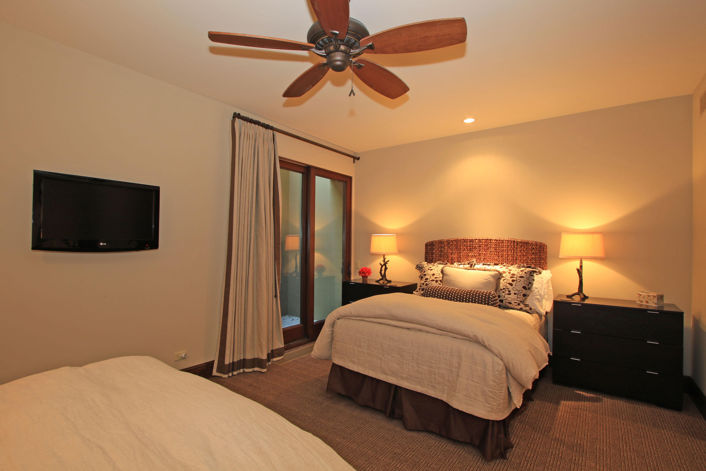 83 Royal St Georges Way Rancho Mirage, CA 92270 - Photo 84 of 123 a bedroom with a bed and a flat screen tv