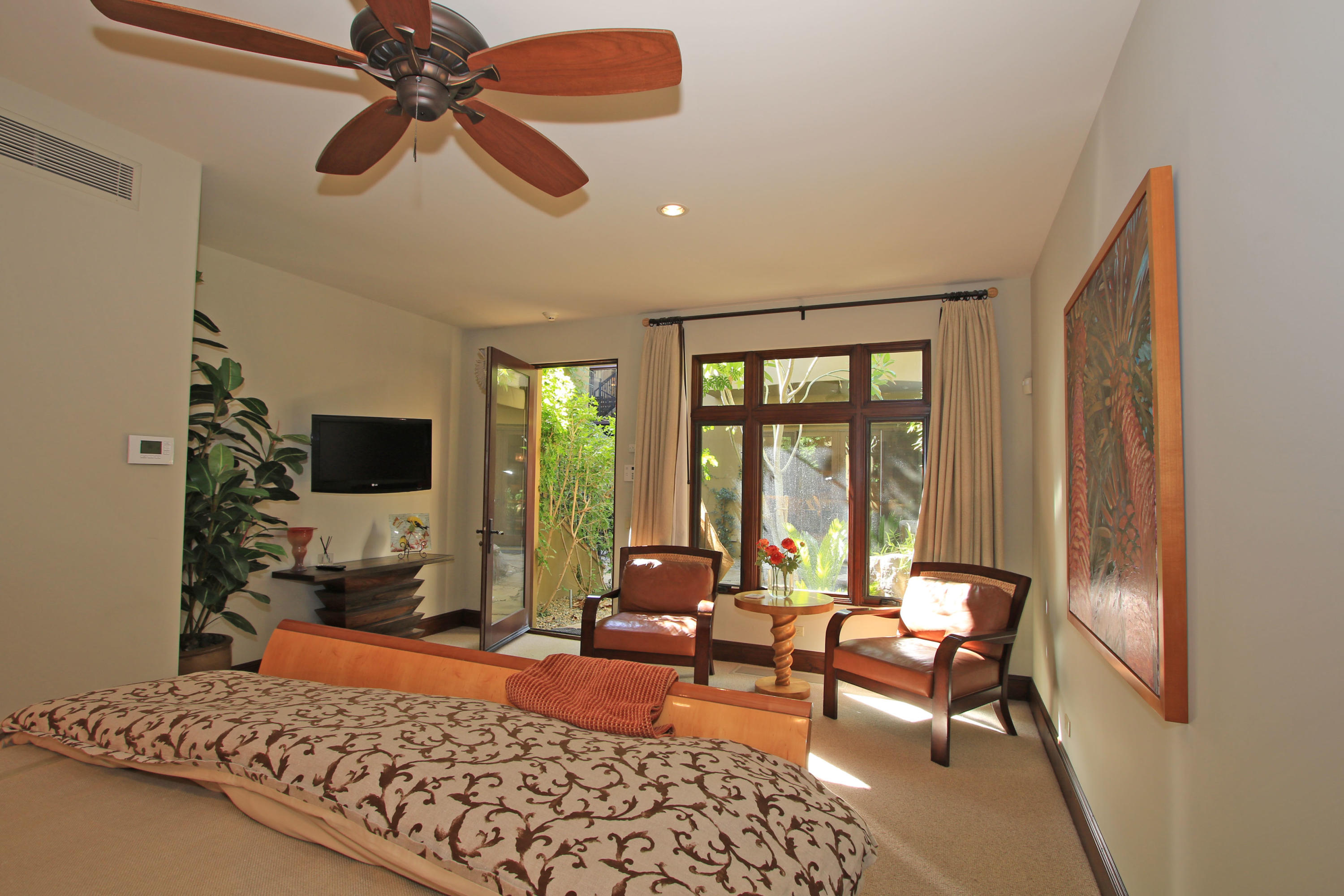 83 Royal St Georges Way Rancho Mirage, CA 92270 - Photo 92 of 123 a living room with furniture and a flat screen tv