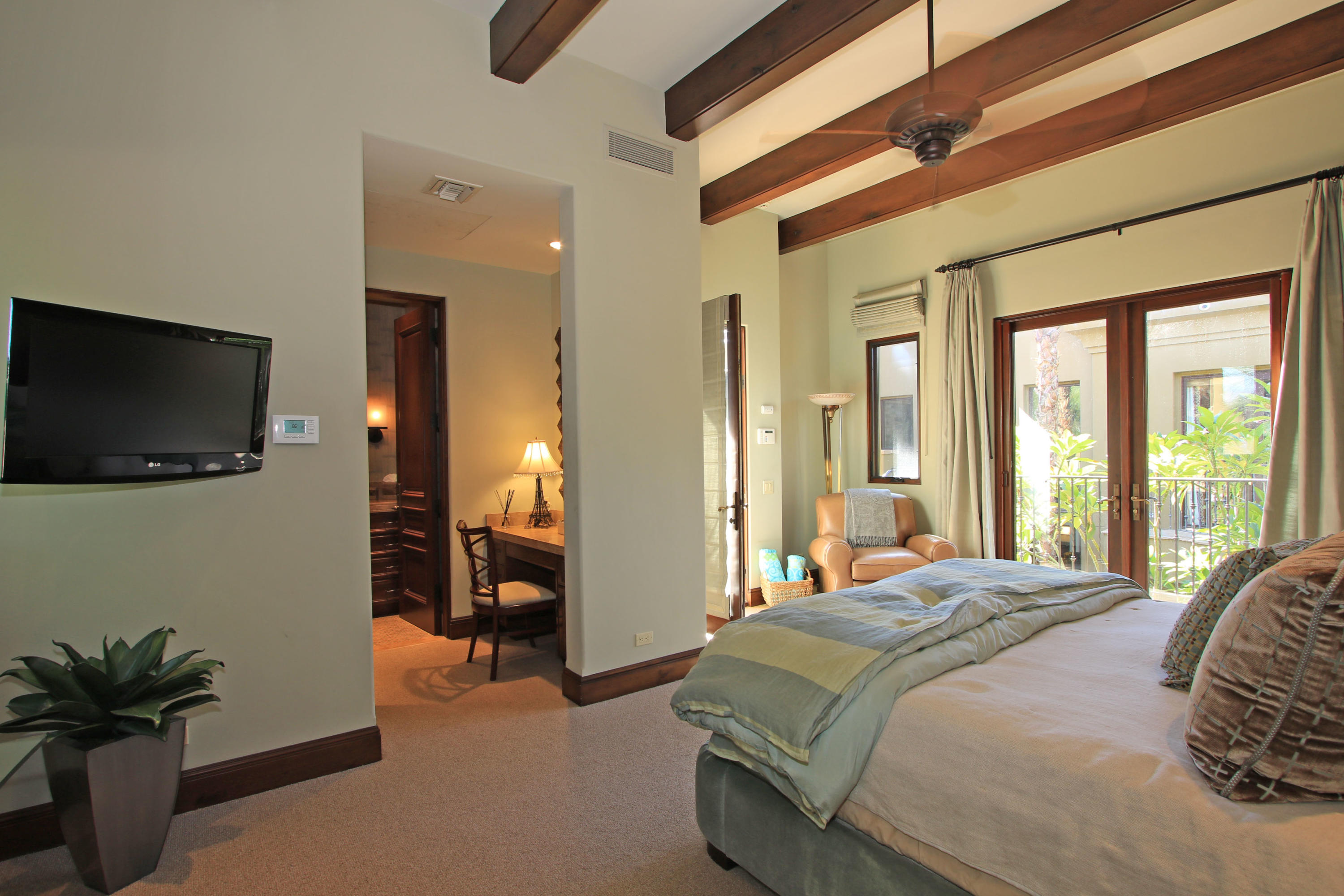 83 Royal St Georges Way Rancho Mirage, CA 92270 - Photo 97 of 123 a bedroom with a bed and a flat screen tv