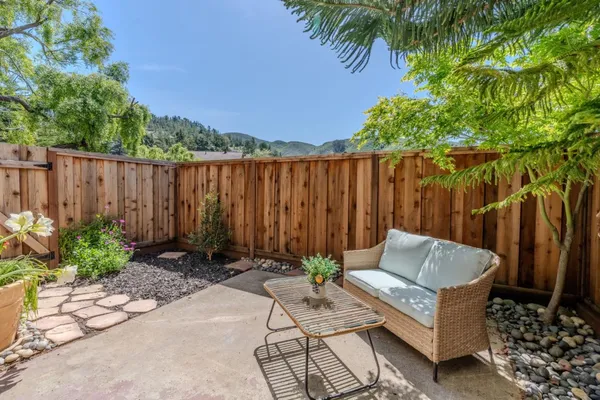 a view of outdoor space with seating area and green space