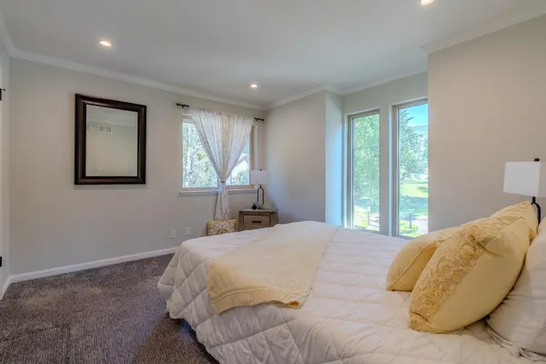 a bedroom with a bed and a sink