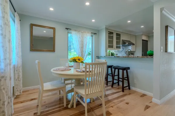 a view of a dining room with furniture and window