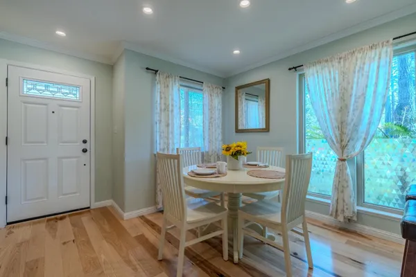 a view of a dining room with furniture and window