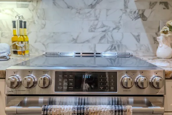 a close view of stove and kitchen island