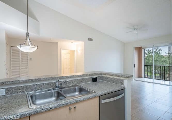 1220 Reserve Way, Unit 305 Naples, FL 34105 - Photo 11 of 20 a kitchen with a sink and a window