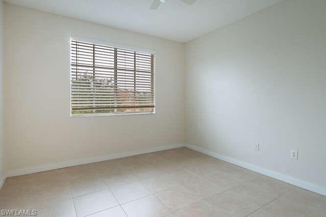 1220 Reserve Way, Unit 305 Naples, FL 34105 - Photo 15 of 20 a view of an empty room with a window