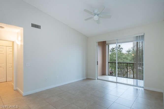 1220 Reserve Way, Unit 305 Naples, FL 34105 - Photo 4 of 20 a view of an empty room with a window