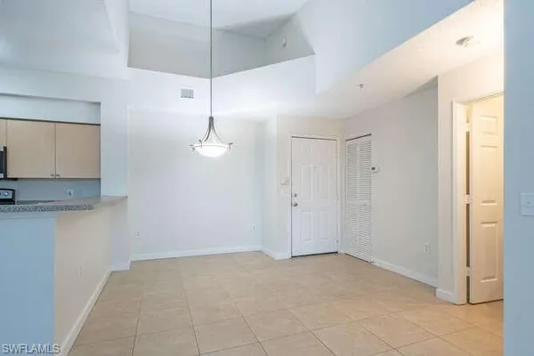 a view of a kitchen with a sink and cabinets