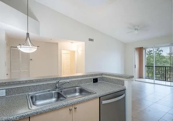 a kitchen with a sink and a window