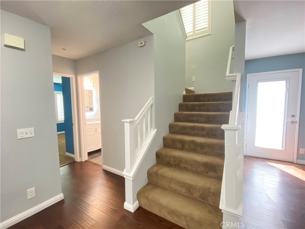 971 Saltcoats Drive Riverside, CA 92508 - Photo 17 of 50 a view of an entryway with wooden floor and stairs