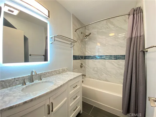 an empty room with a fan