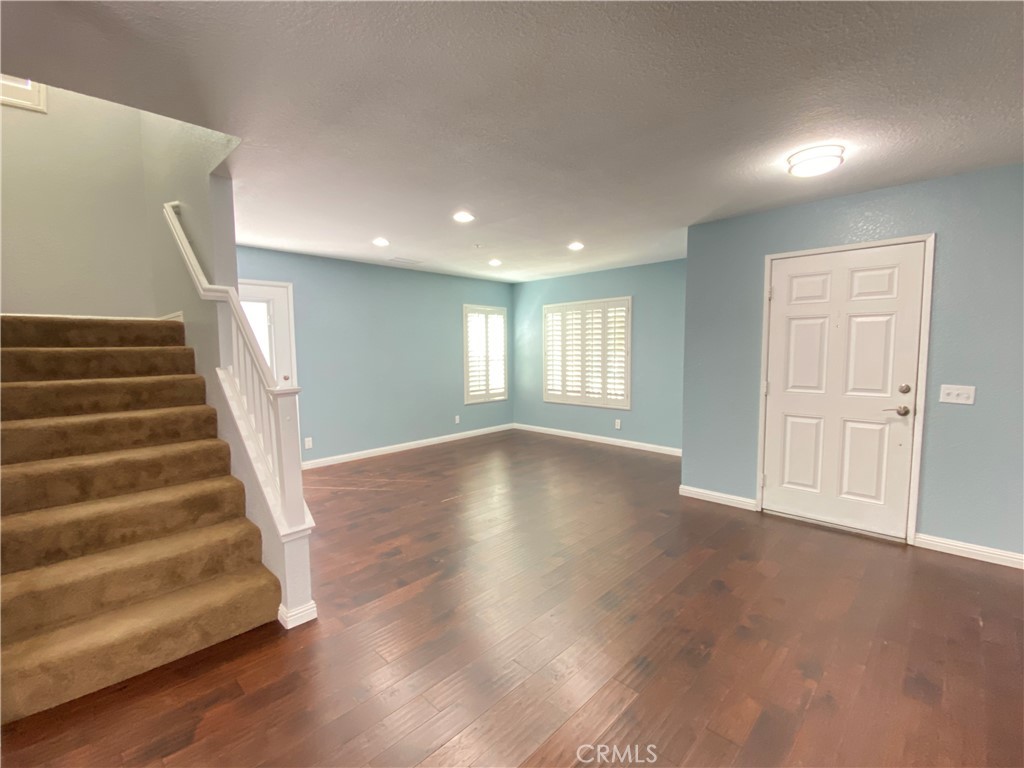 971 Saltcoats Drive Riverside, CA 92508 - Photo 2 of 50 a view of an empty room with wooden floor and windows
