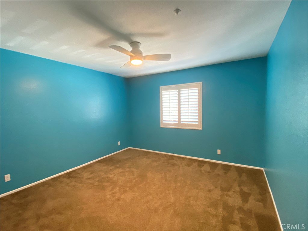 971 Saltcoats Drive Riverside, CA 92508 - Photo 36 of 50 an empty room with windows and fan