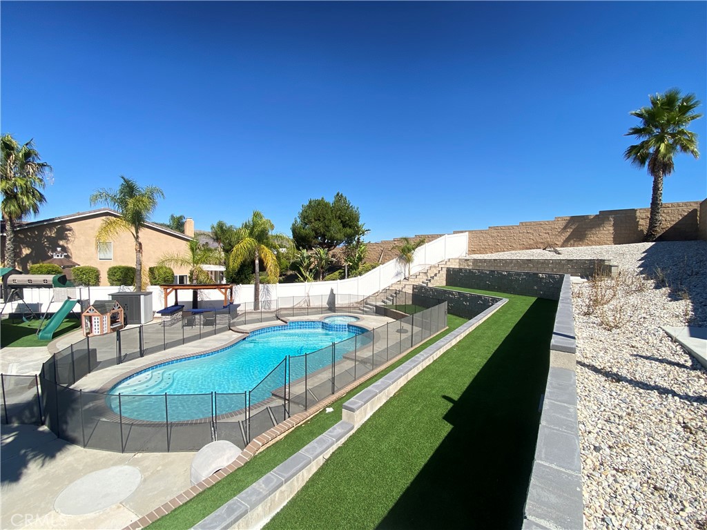 971 Saltcoats Drive Riverside, CA 92508 - Photo 43 of 50 a view of a swimming pool with an outdoor seating