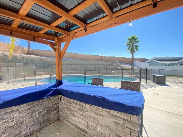 a view of a patio with couches and potted plants