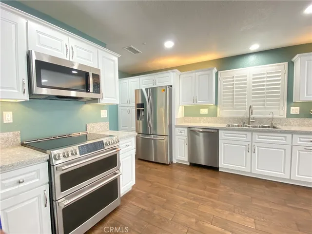 a large bathroom with a sink and mirror
